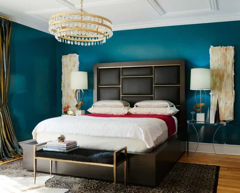 Dark Teal Wall with Golden Lighting and Gray  bed frame